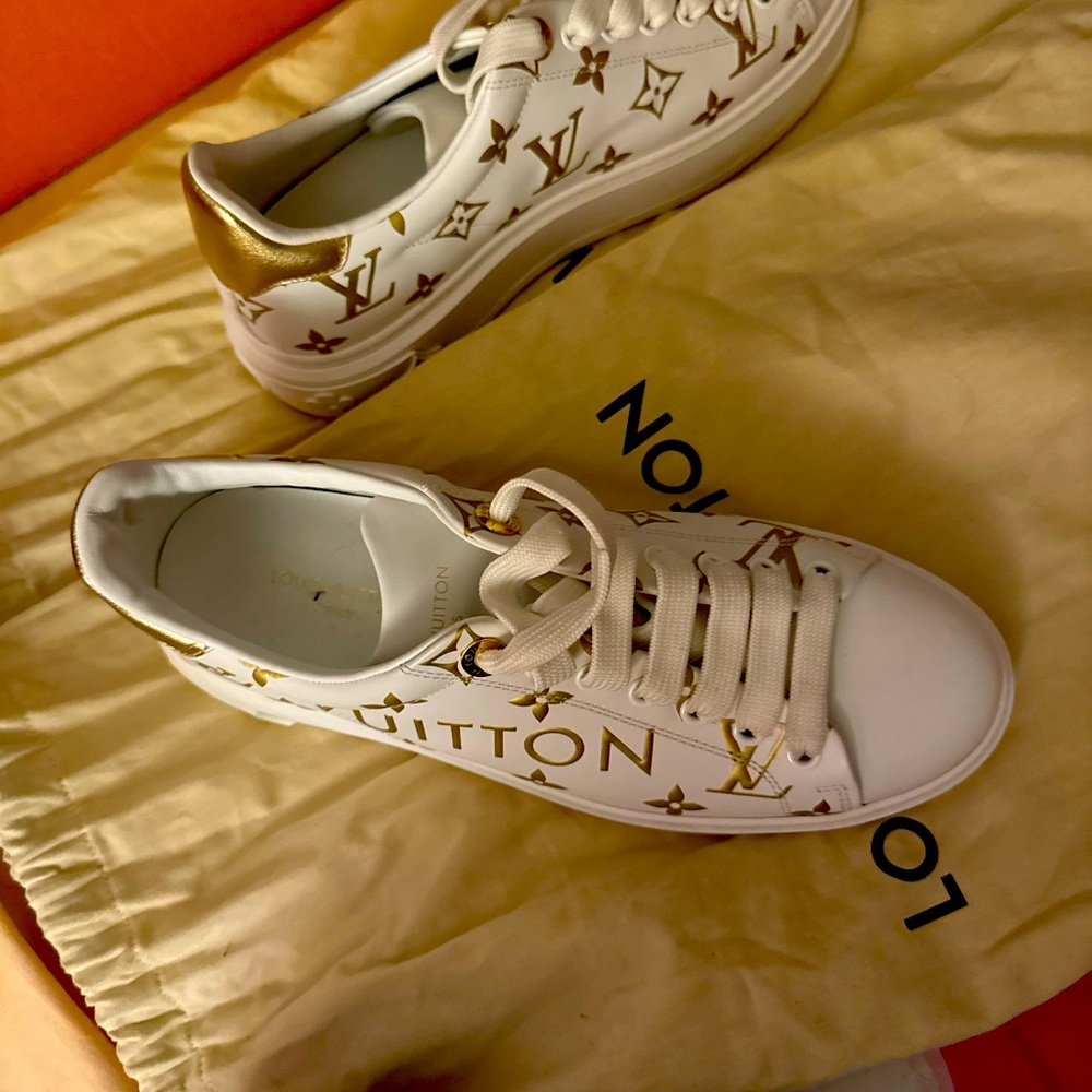 Louis Vuitton White and Gold Sneakers
serious inquiries no scams or links